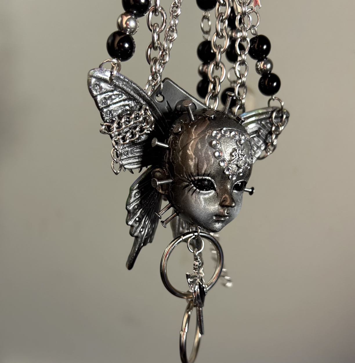 Metallic Butterfly Doll Head Necklace